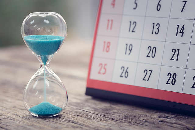 Hour glass and calendar important appointment date, schedule and